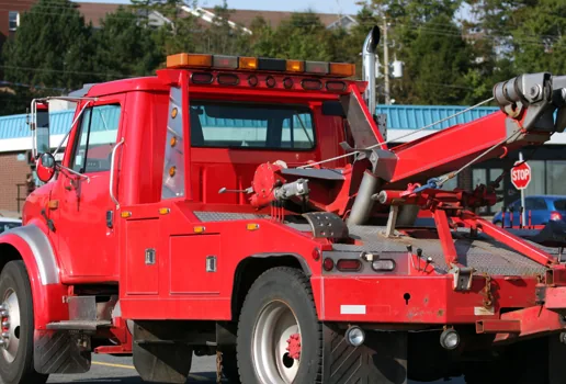A Affordable Towing red tow truck ready for a call in Peabody, MA